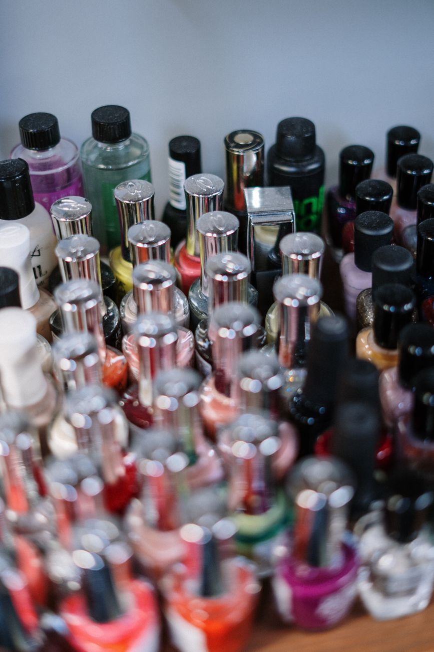 clear glass bottles on black metal rack