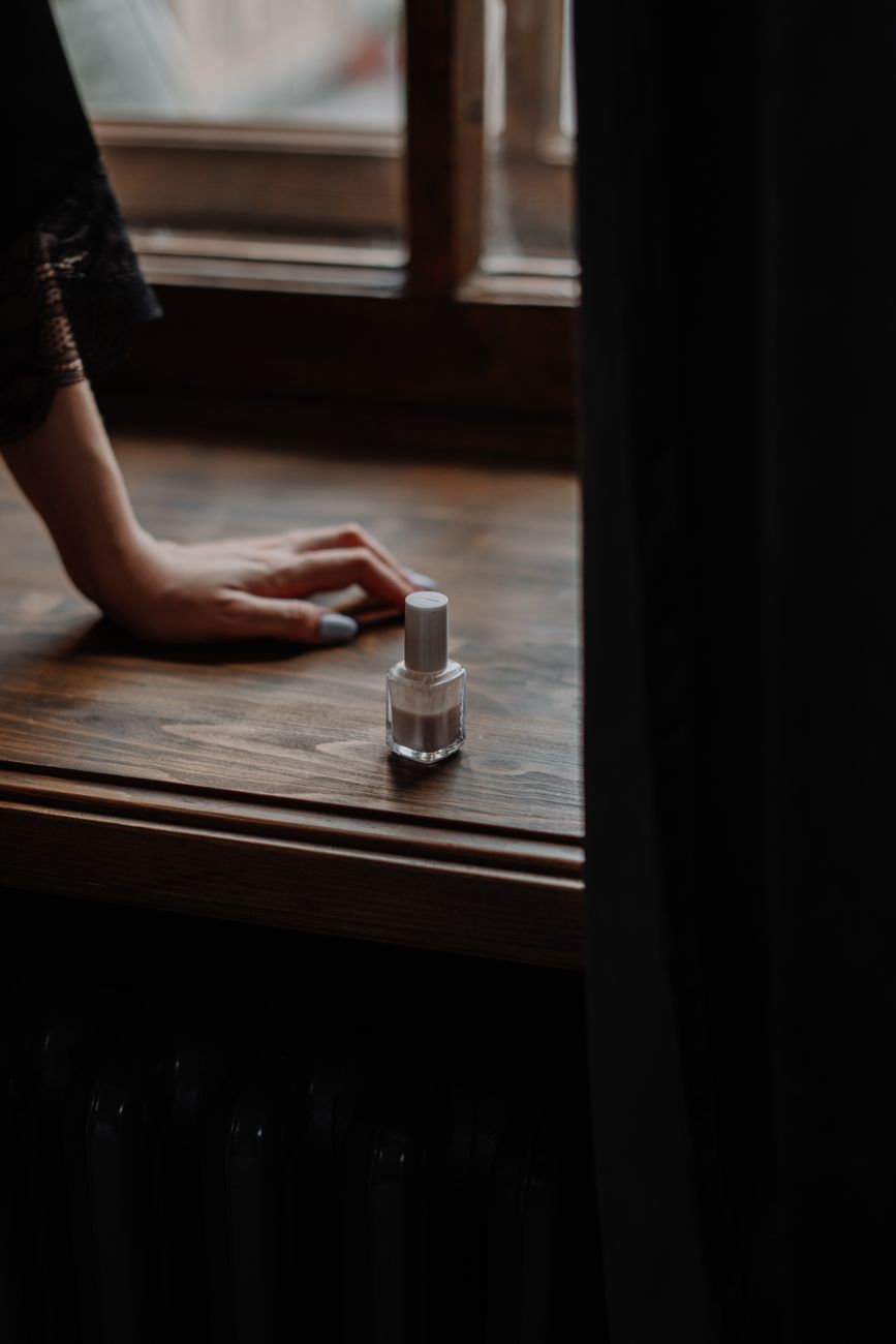 person in black shirt sitting by the table
